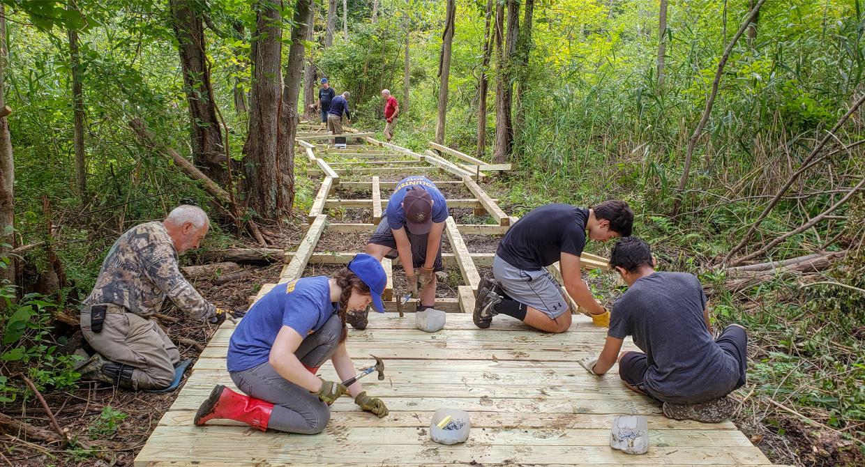 Westchester Trail Crew works on the Mohansic Trailway boardwalk. Photo by Jane Daniels.