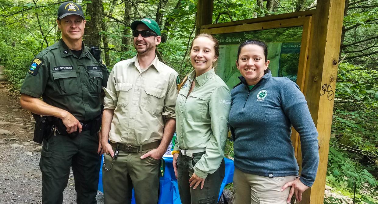 C. Stephens, Ian Dunn, Nikki Wowaka, and Sabina Cardenas greeted and educated visitors at the Blue Hole.