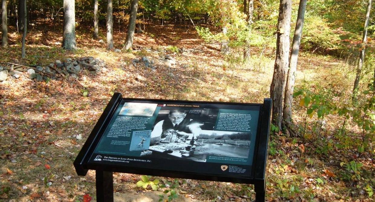 Trail interpretative sign on the Hasenclever Iron Trail. Photo by Paul Frost.