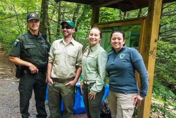 C. Stephens, Ian Dunn, Nikki Wowaka, and Sabina Cardenas greeted and educated visitors at the Blue Hole.