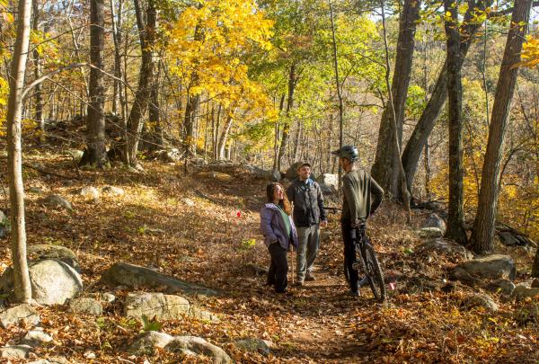 Hikers and Mountain Biker meet on Sterling Forest's multi-use trails. Photo by Robert Celestin.