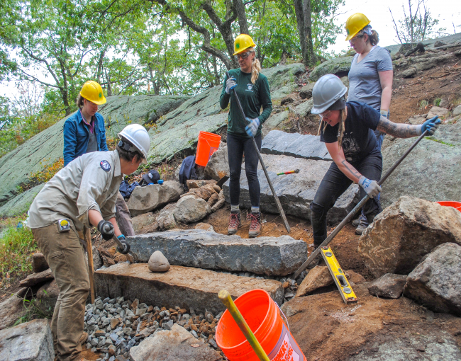 Volunteers set steps on the Appalachian Trail at Bear Mountain. Photo by Heather Darley.