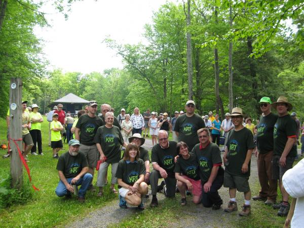 Members of the Kaaterskill Rail Trail Committee with walkers eager to explore the just opened trail. The 100-year-old  train station is in the background.